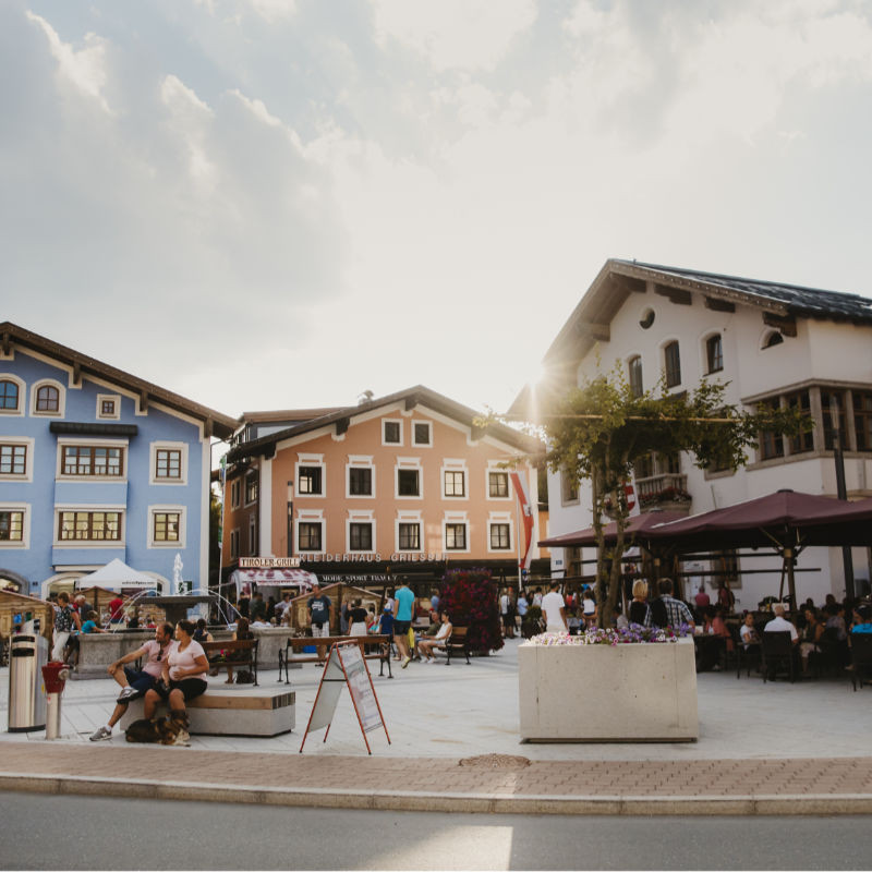 Shopping in the center of Mittersill on a sunny summer afternoon, lively with a friendly atmosphere.