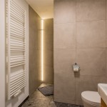 Brightly lit, modern bathroom with towel dryer in the Hoferlitzlhubgut vacation apartment in Mittersill. thumbnail