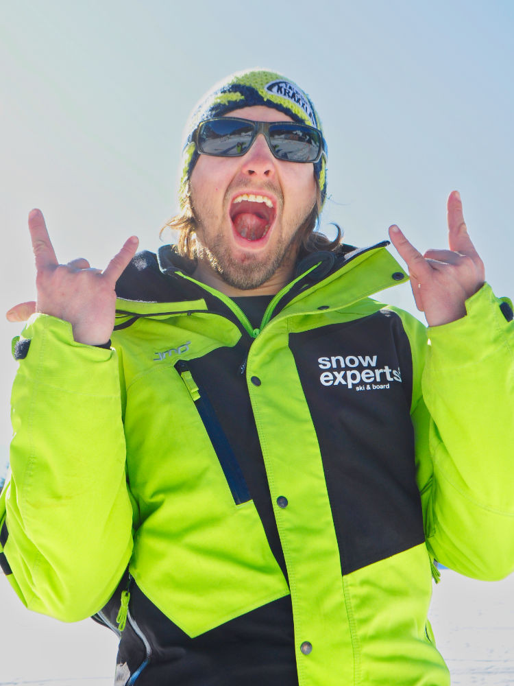 Close-up of the head snowboard instructor in the KitzSki ski area, showing his enthusiasm for winter sports.