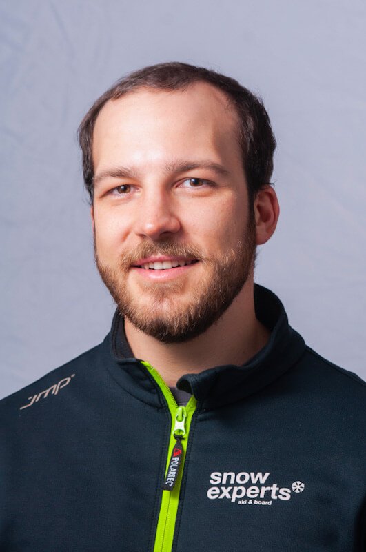 Lukas Gruber, state-certified ski instructor and trainer at the Snowsports Academy, during a professional portrait photo shoot in the KitzSki ski resort.
